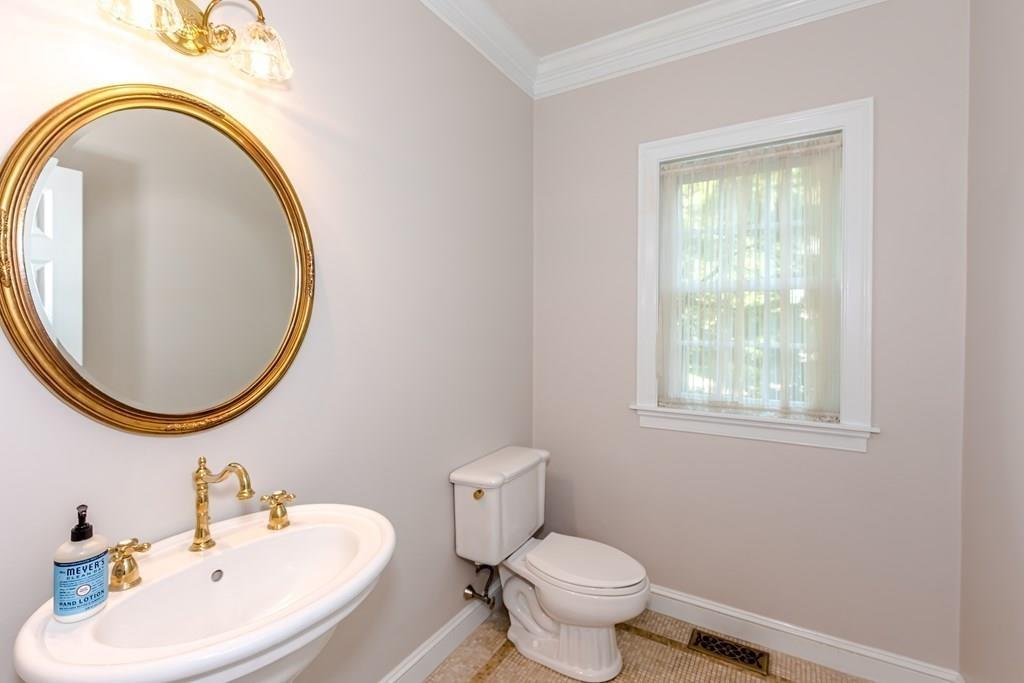 38 Bowditch Road Sudbury, MA 01776 - Photo 17 of 42 a bathroom with a sink a toilet and a mirror