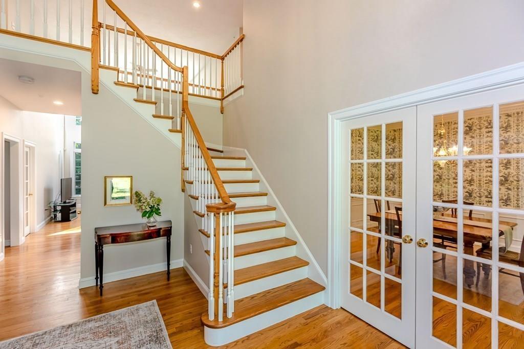 38 Bowditch Road Sudbury, MA 01776 - Photo 18 of 42 a view of staircase with wooden floor and windows