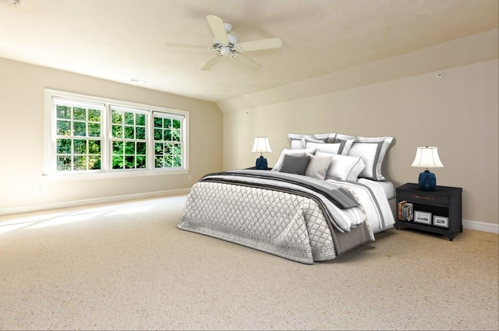 38 Bowditch Road Sudbury, MA 01776 - Photo 22 of 42 a spacious bedroom with a bed and a large window