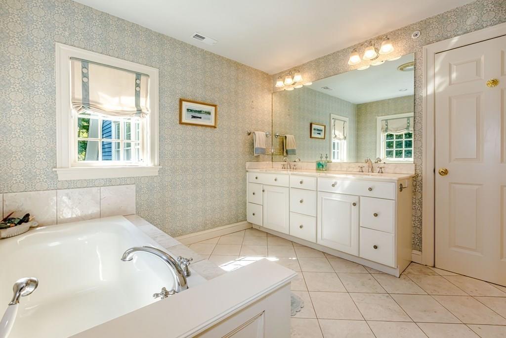 38 Bowditch Road Sudbury, MA 01776 - Photo 25 of 42 a spacious bathroom with a tub sink and mirror
