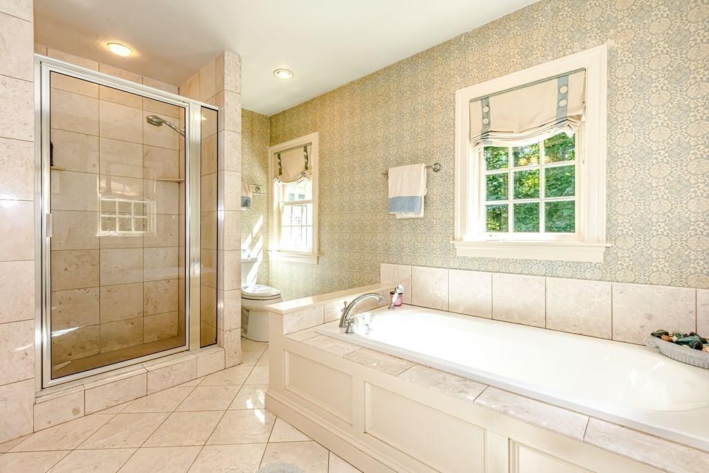 38 Bowditch Road Sudbury, MA 01776 - Photo 26 of 42 a bathroom with a bathtub and a shower