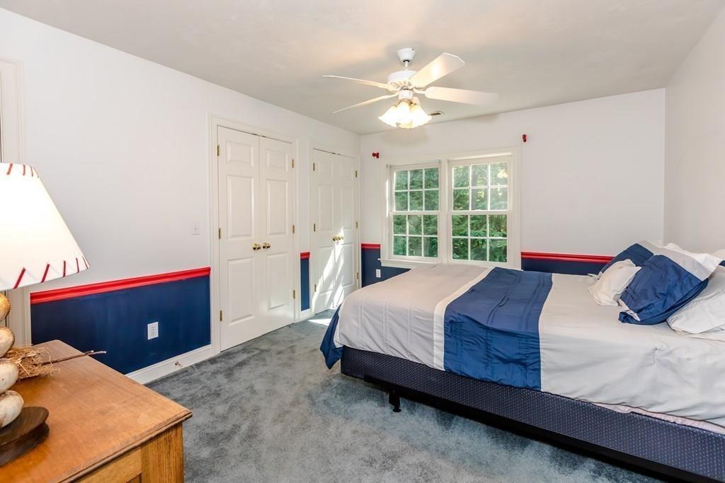 38 Bowditch Road Sudbury, MA 01776 - Photo 30 of 42 a bedroom with a bed and window