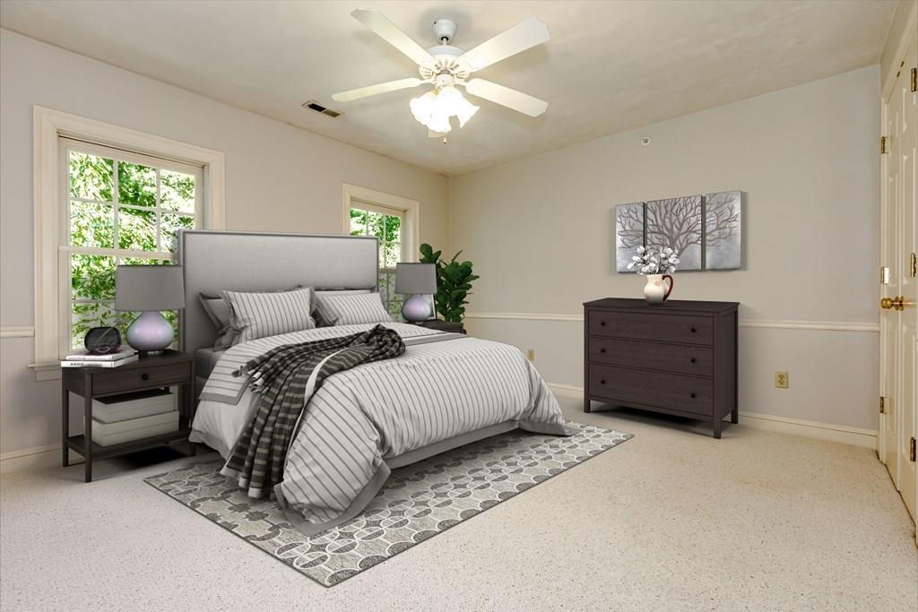 38 Bowditch Road Sudbury, MA 01776 - Photo 31 of 42 a spacious bedroom with a bed and a painting on the wall