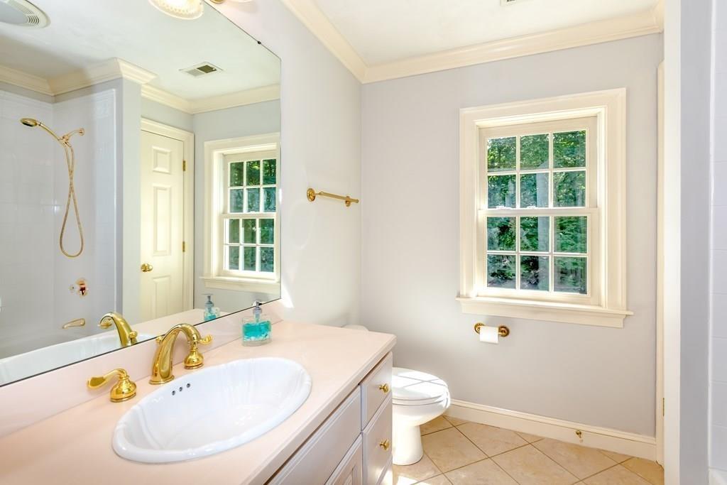 38 Bowditch Road Sudbury, MA 01776 - Photo 32 of 42 a bathroom with a sink and a mirror