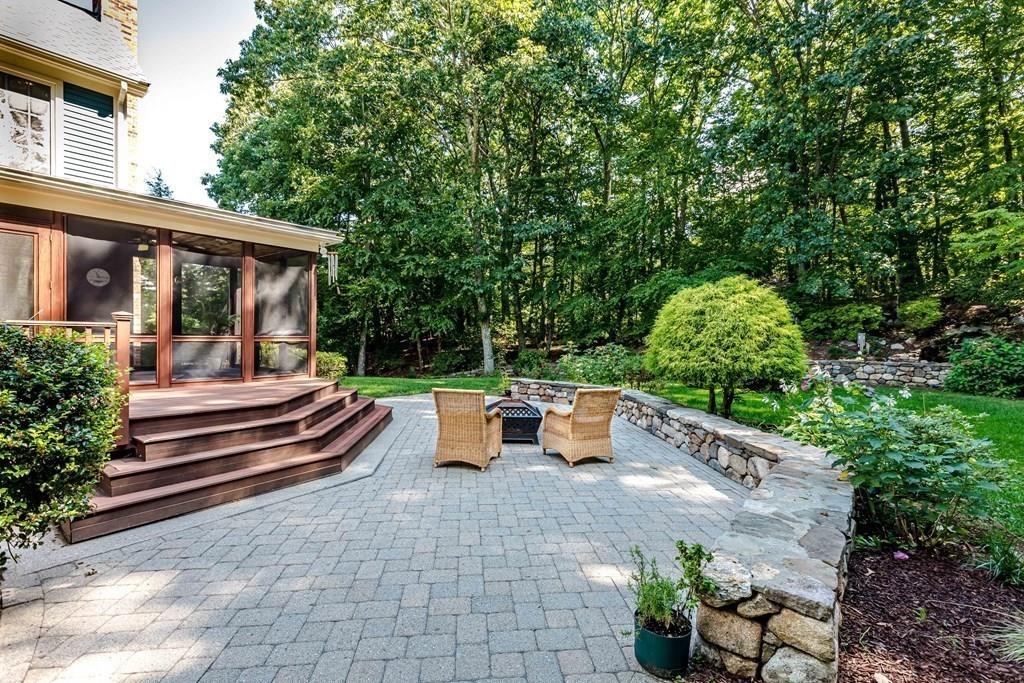 38 Bowditch Road Sudbury, MA 01776 - Photo 36 of 42 a view of a patio with couches table and chairs and potted plants