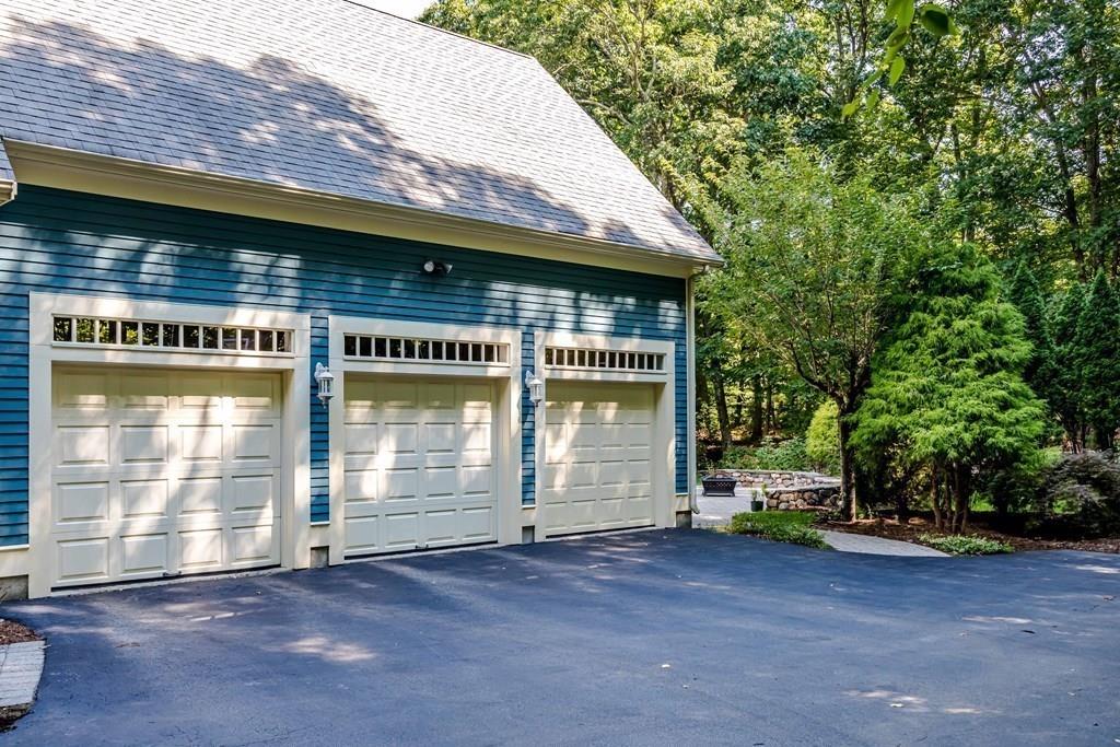 38 Bowditch Road Sudbury, MA 01776 - Photo 39 of 42 a front view of a house with a yard