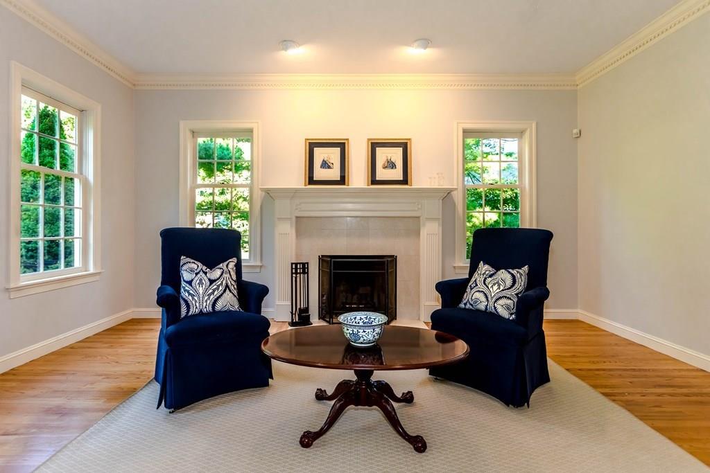 38 Bowditch Road Sudbury, MA 01776 - Photo 5 of 42 a living room with furniture and a fireplace