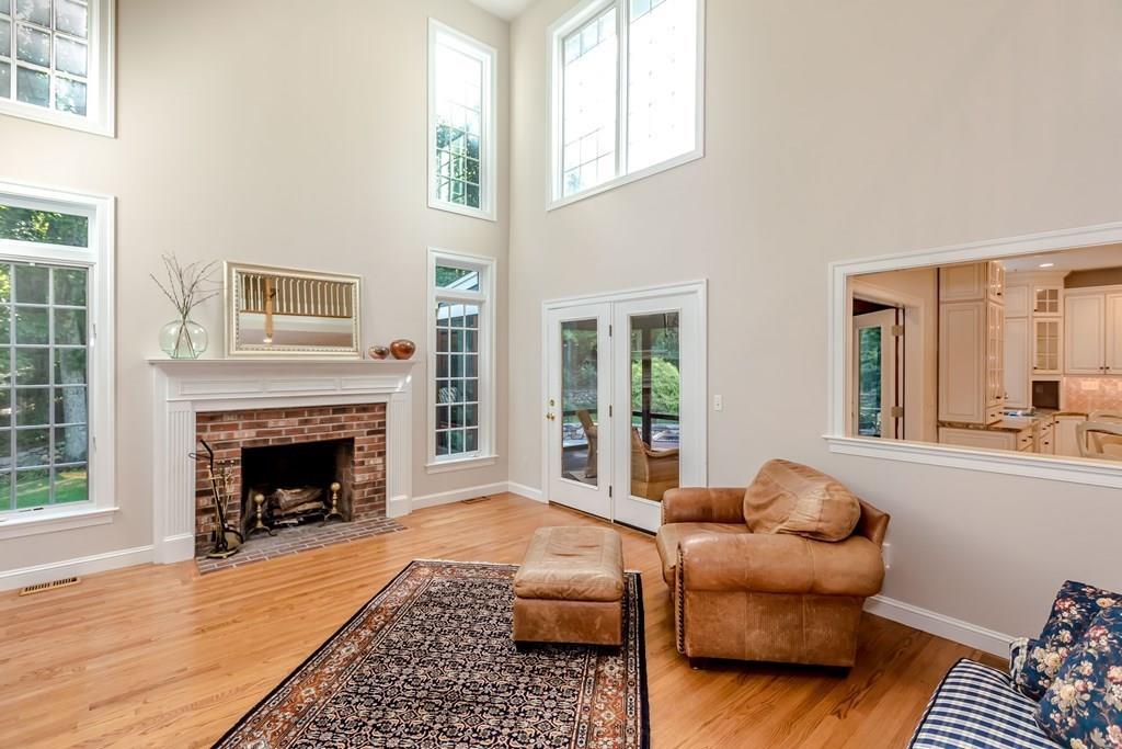 38 Bowditch Road Sudbury, MA 01776 - Photo 8 of 42 a living room with furniture and a fireplace