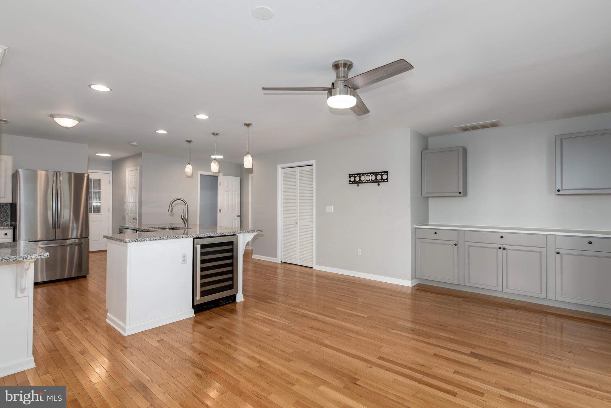 6824 Hopkins Neck Road Easton, MD 21601 - Photo 11 of 45 a view of a kitchen with wooden floor and electronic appliances