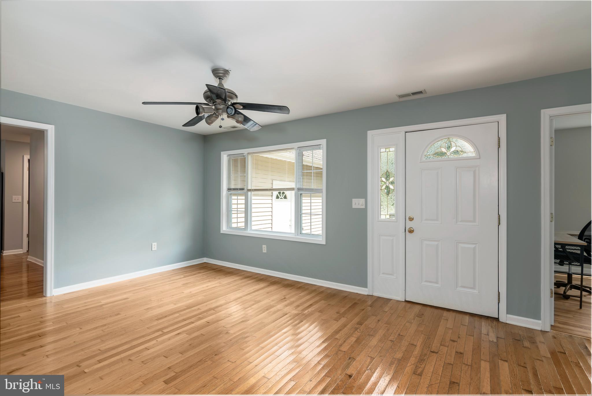6824 Hopkins Neck Road Easton, MD 21601 - Photo 18 of 45 wooden floor in an empty room with a window