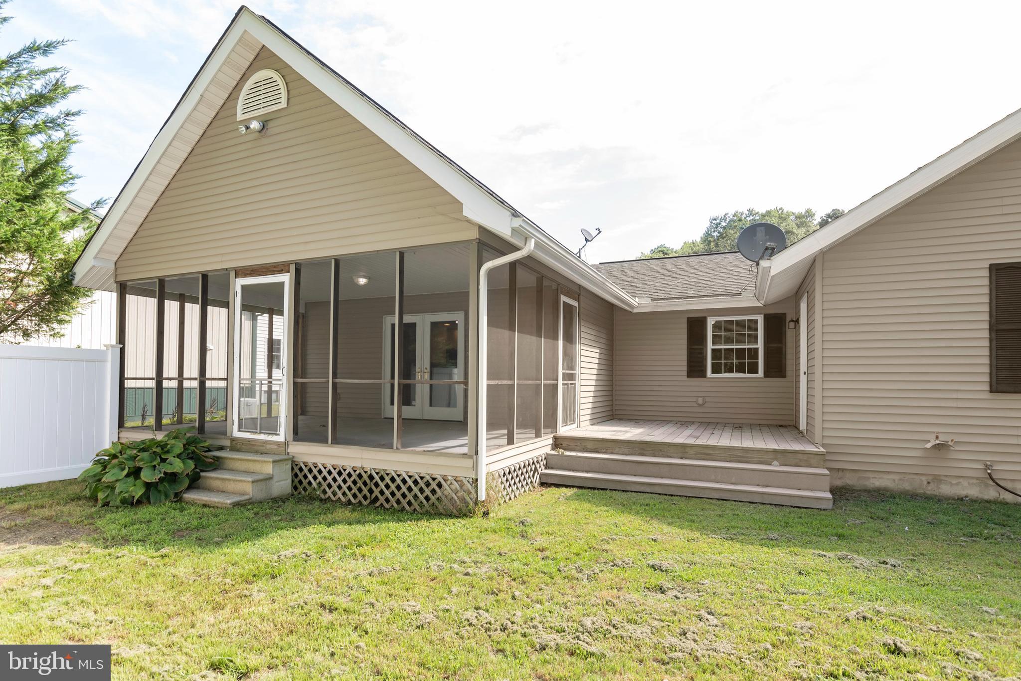 6824 Hopkins Neck Road Easton, MD 21601 - Photo 39 of 45 a view of a house with a bed and a yard