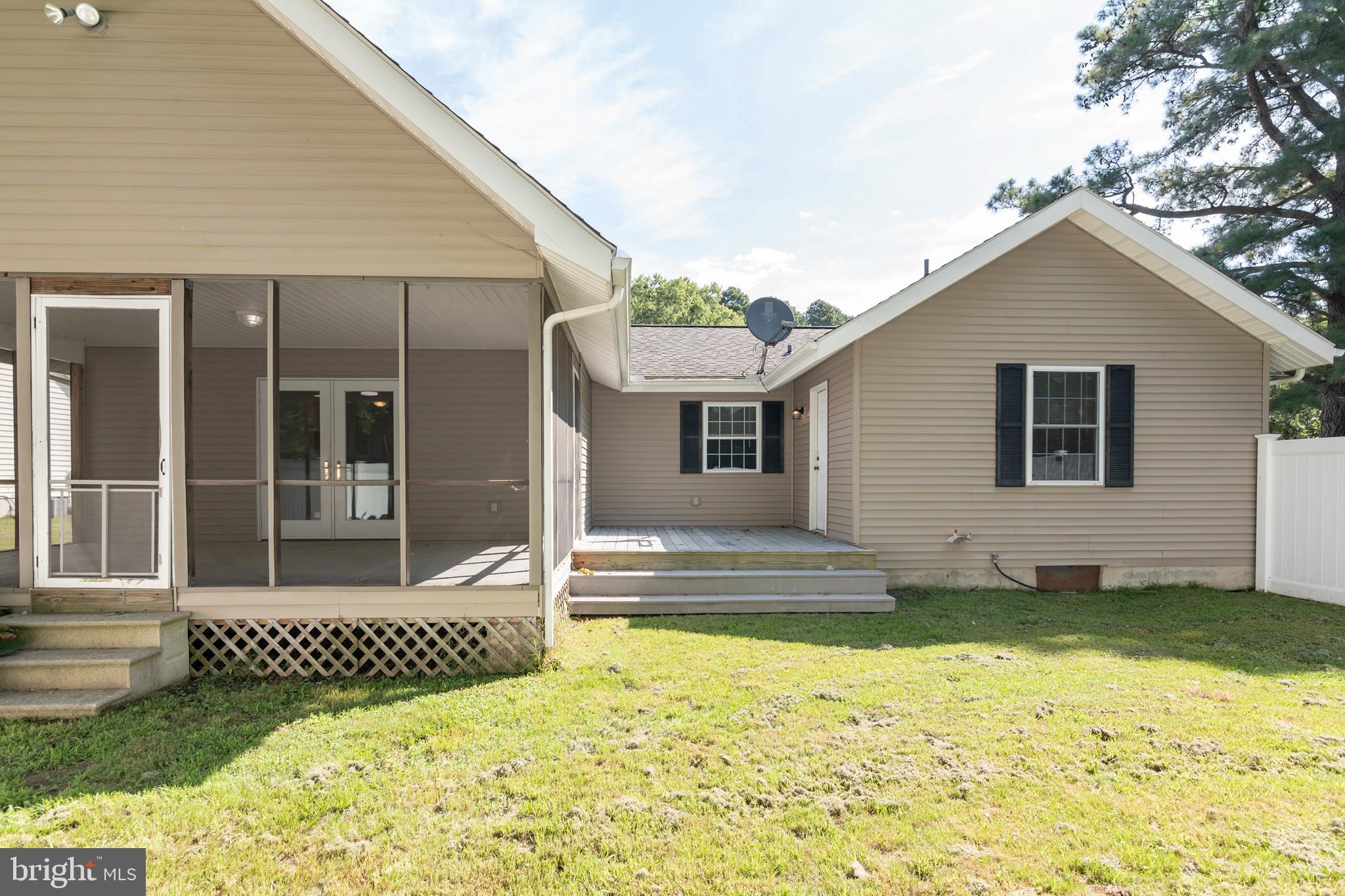 6824 Hopkins Neck Road Easton, MD 21601 - Photo 42 of 45 a view of a house with a yard