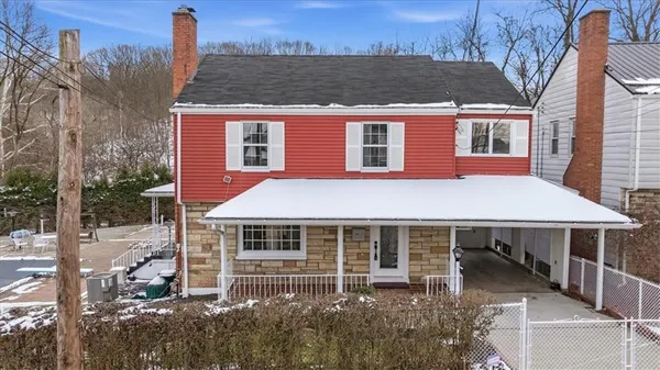 a aerial view of a house with a yard