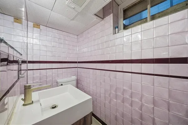 a bathroom with a sink and shower
