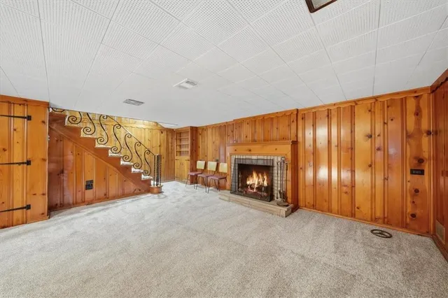 a view of an empty room with a fireplace