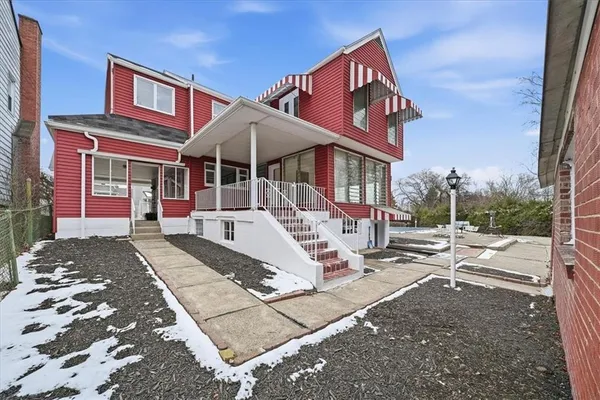 a front view of a house with a yard