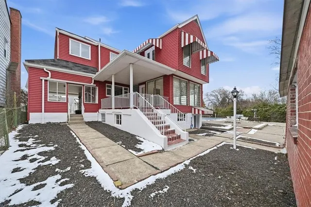 a front view of a house with a yard