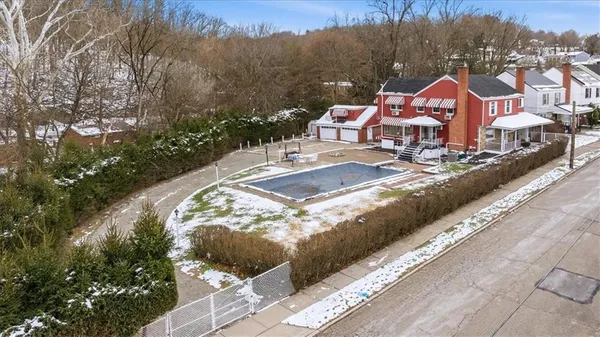 a view of a house with a yard and garden