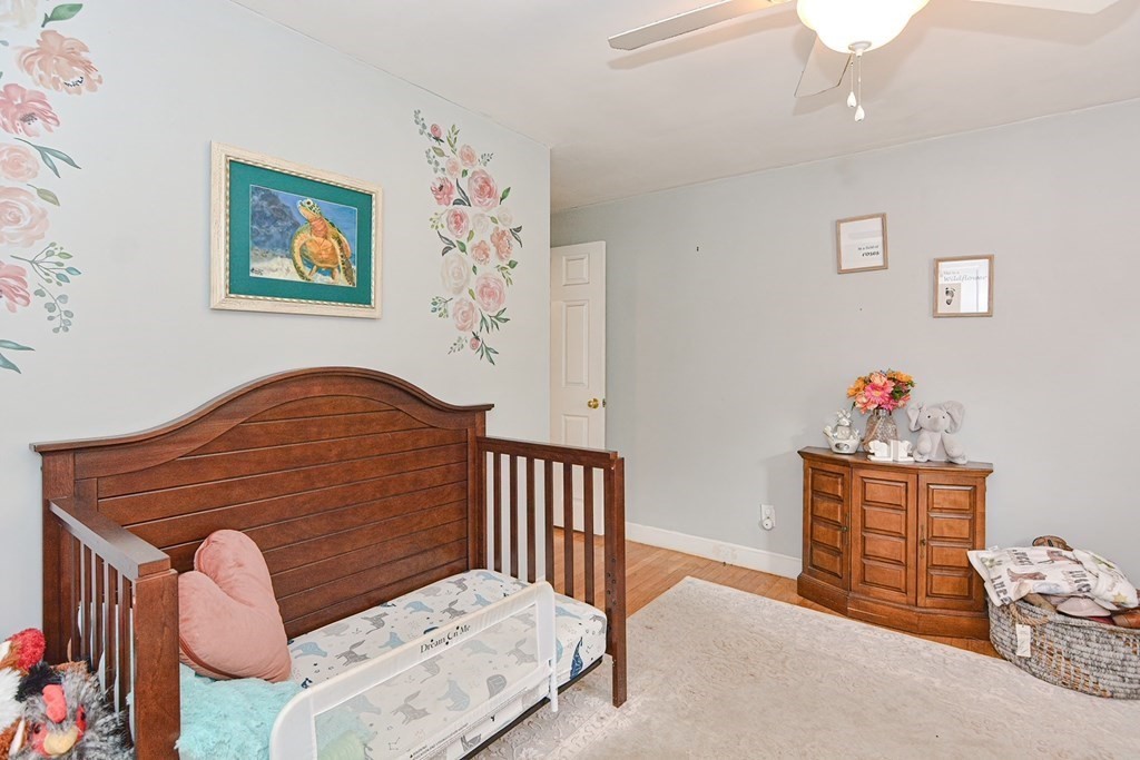 38 Spring Street Plainville, MA 02762 - Photo 12 of 23 a bedroom with furniture and baby crib