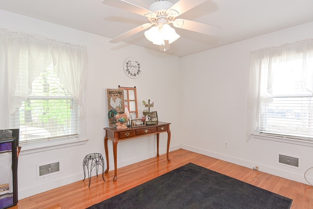 38 Spring Street Plainville, MA 02762 - Photo 15 of 23 a view of a livingroom with a window and wooden floor