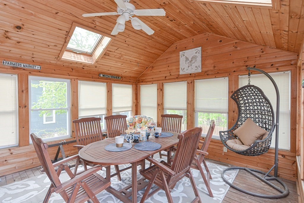 38 Spring Street Plainville, MA 02762 - Photo 20 of 23 a dining room with furniture a chandelier and wooden floor
