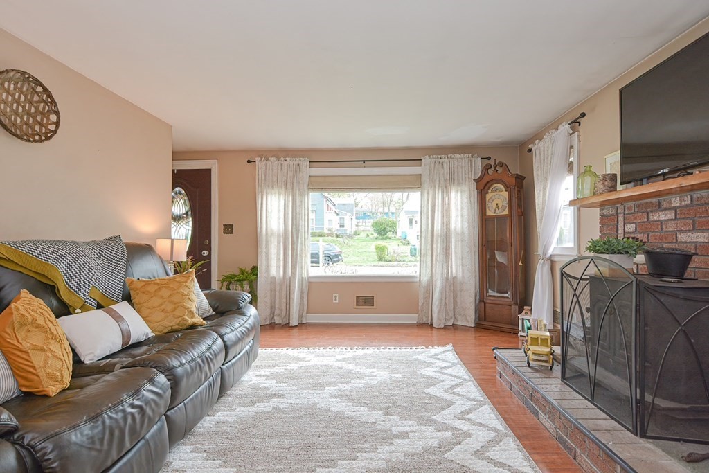 38 Spring Street Plainville, MA 02762 - Photo 3 of 23 a living room with furniture and a flat screen tv