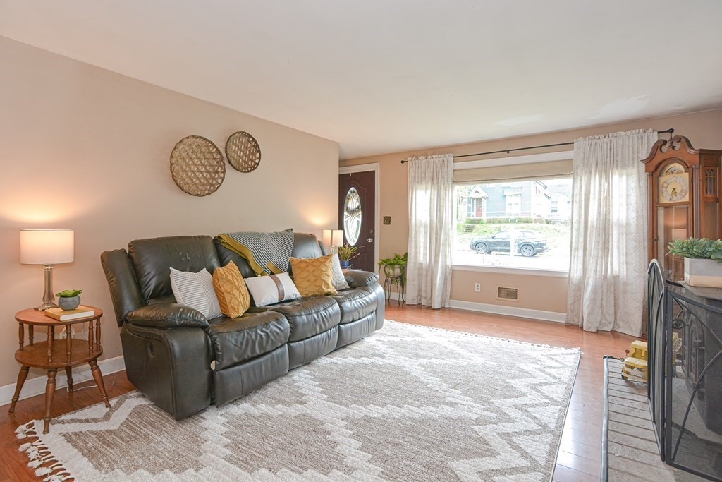 38 Spring Street Plainville, MA 02762 - Photo 4 of 23 a living room with furniture and a window