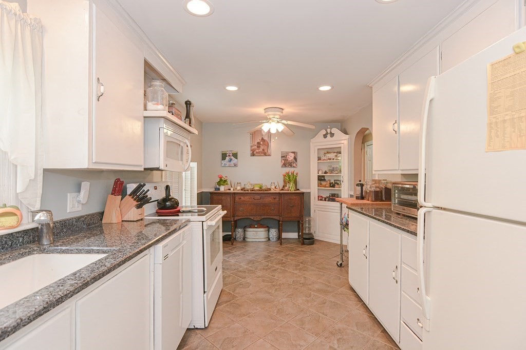 38 Spring Street Plainville, MA 02762 - Photo 8 of 23 a large kitchen with stainless steel appliances granite countertop a lot of counter space and a sink