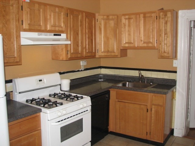 a kitchen with a stove and a cabinet