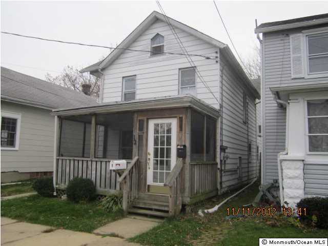12 Warren Street Keyport, NJ 07735 - Photo 1 of 1 a front view of a house with a yard