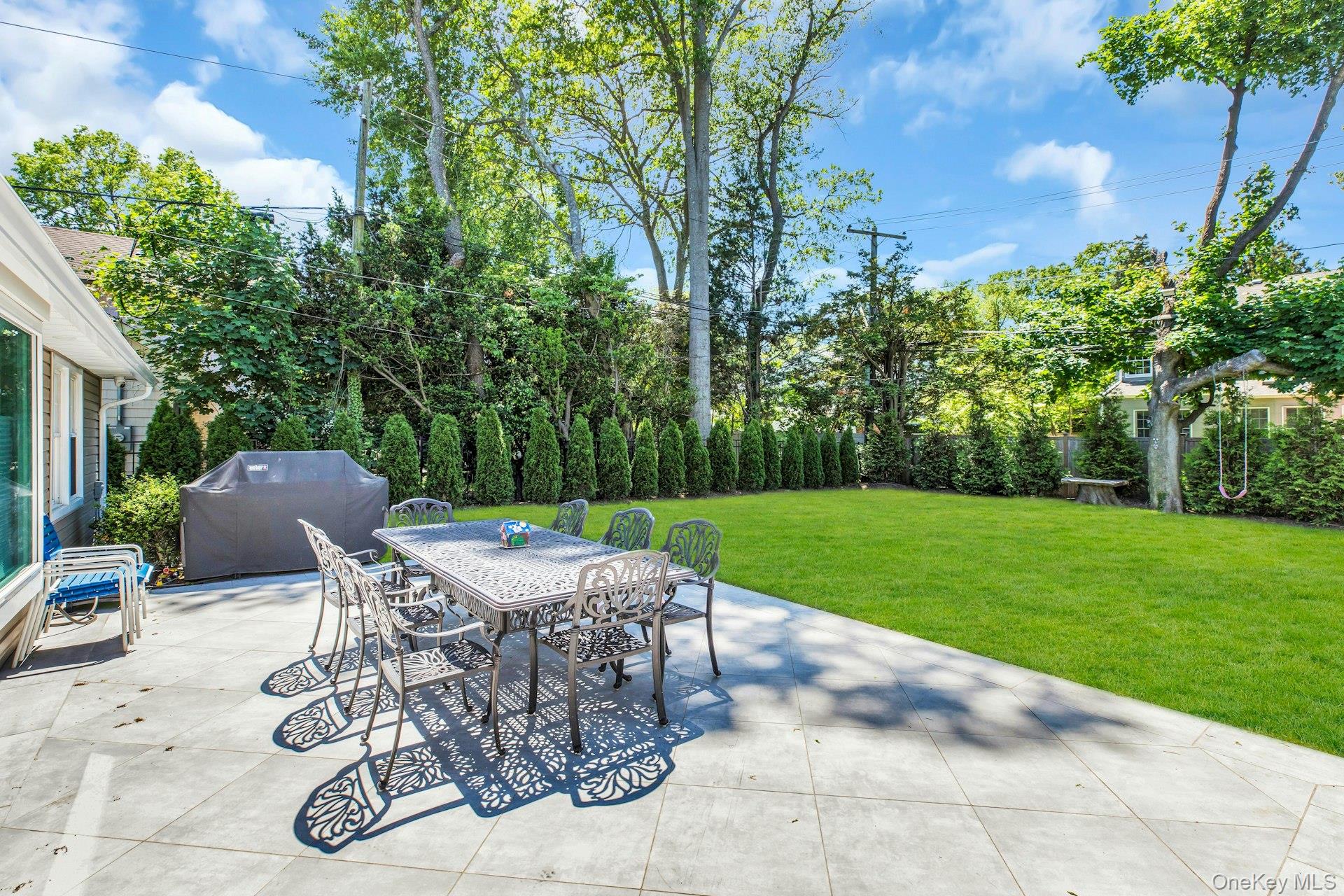 20 Robert Road Glen Cove, NY 11542 - Photo 20 of 23 Outdoor patio with porcelain large tiles, Gas pipe for gas BBQ done. generators hoop up,