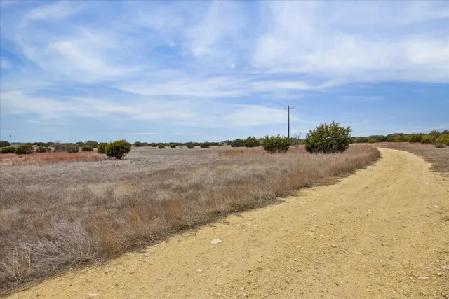 a view of swimming pool with a yard
