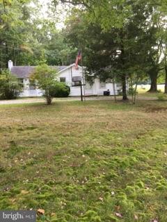 20033 Point Lookout Road Lexington Park, MD 20653 - Photo 1 of 12 a view of a houses with yard and lake view