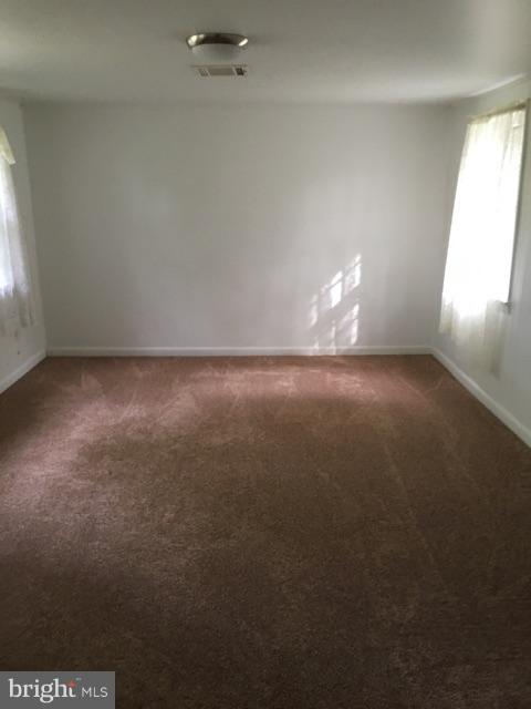20033 Point Lookout Road Lexington Park, MD 20653 - Photo 2 of 12 a view of an empty room and window