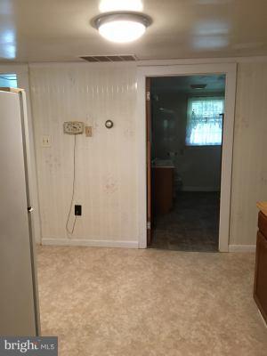 20033 Point Lookout Road Lexington Park, MD 20653 - Photo 5 of 12 a view of an empty room