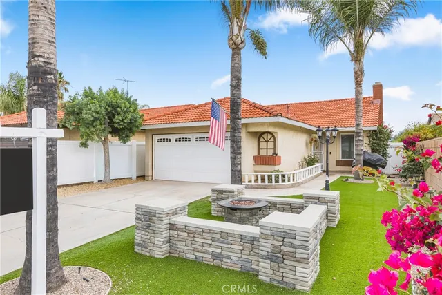 a front view of house with yard and seating area
