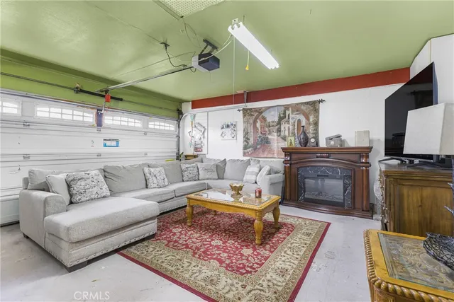 a living room with furniture and a rug