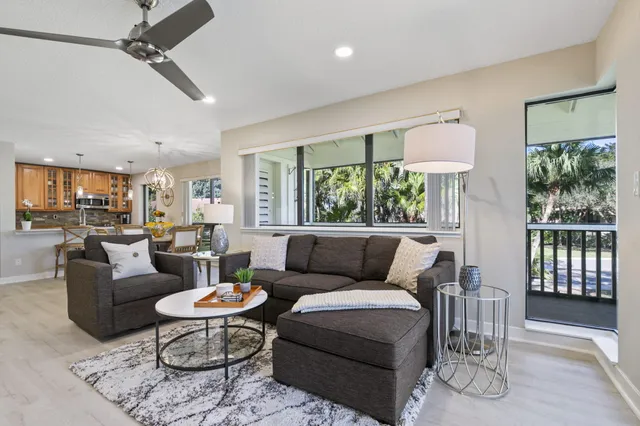 a living room with fireplace furniture and a flat screen tv