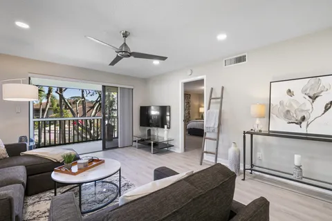 a bedroom with a bed and a lamp