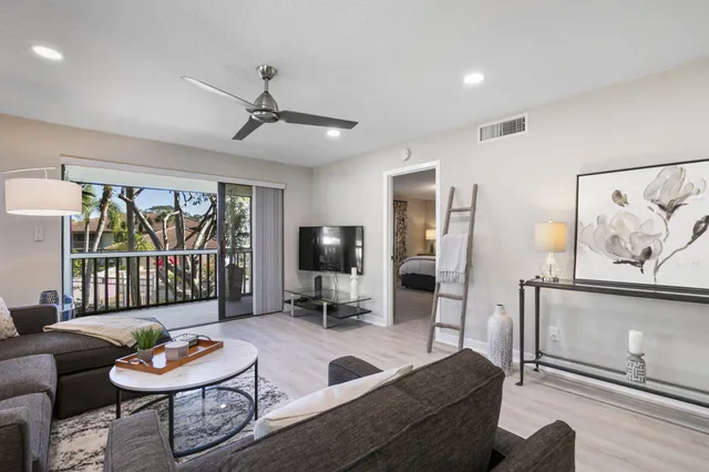 a bedroom with a bed and a lamp