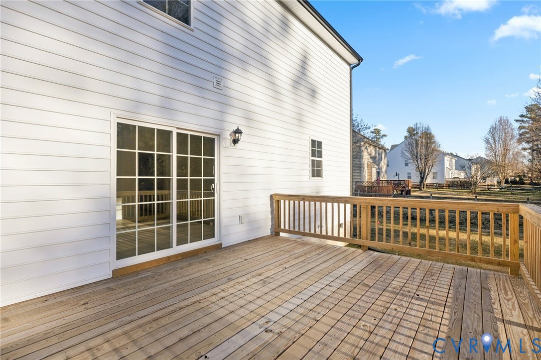13619 Brandy Oaks Road Chesterfield, VA 23832 - Photo 4 of 28 a view of a balcony with a floor to ceiling window and wooden floor