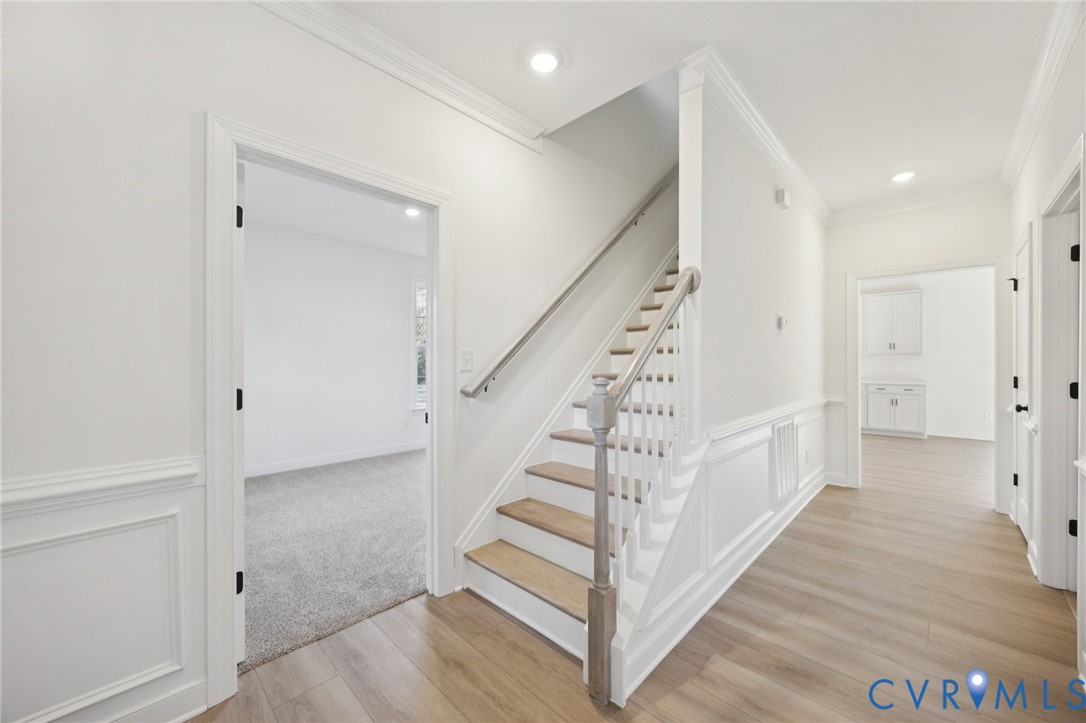 13619 Brandy Oaks Road Chesterfield, VA 23832 - Photo 5 of 28 a view of a hallway with stairs and wooden floor