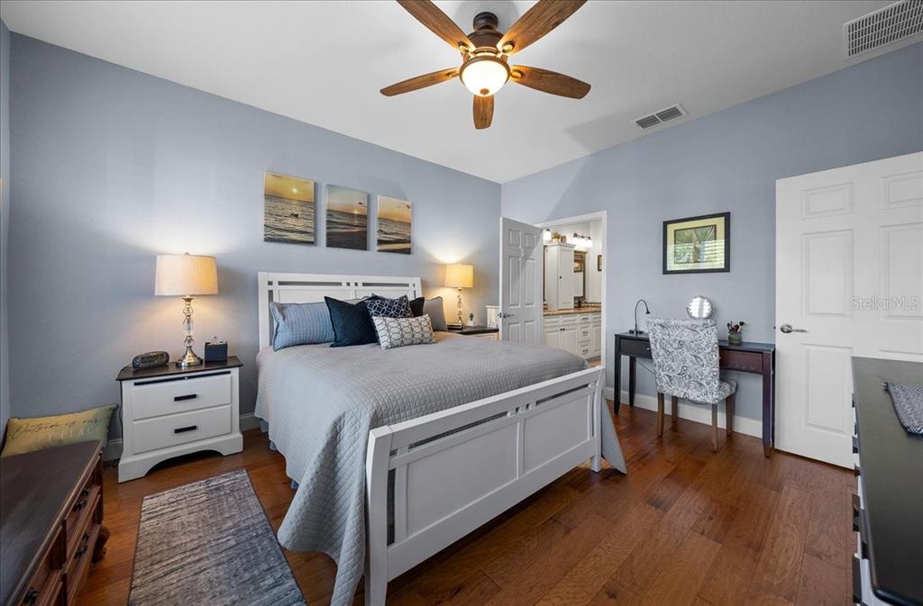 9586 Southwest 70th Loop Ocala, FL 34481 - Photo 12 of 21 a bedroom with a bed and wooden floor