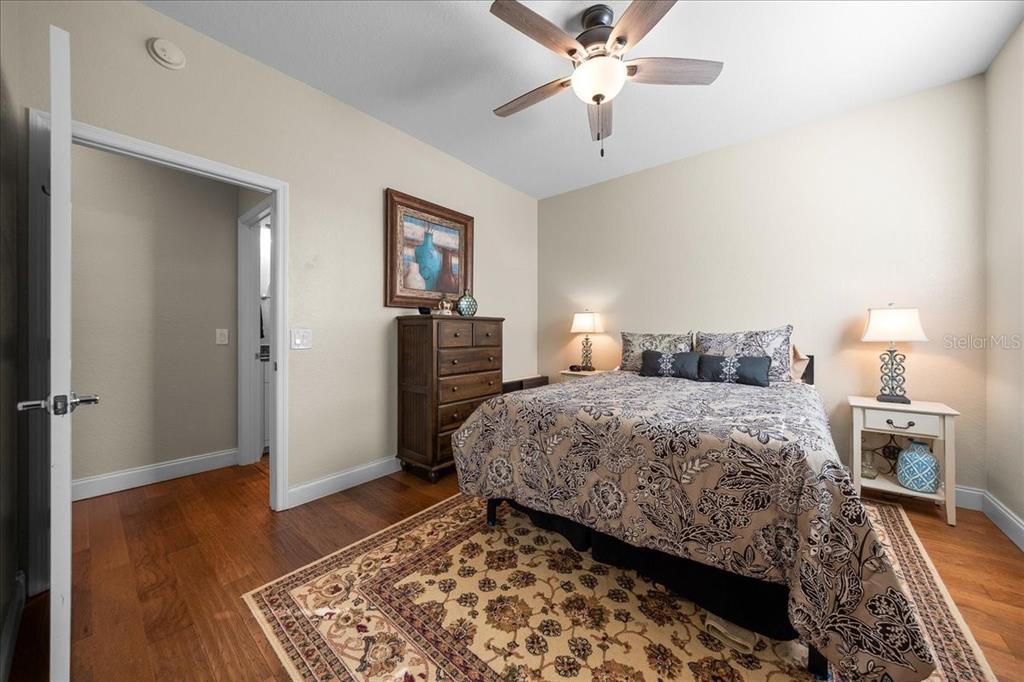 9586 Southwest 70th Loop Ocala, FL 34481 - Photo 15 of 21 a bedroom with a bed and wooden floor