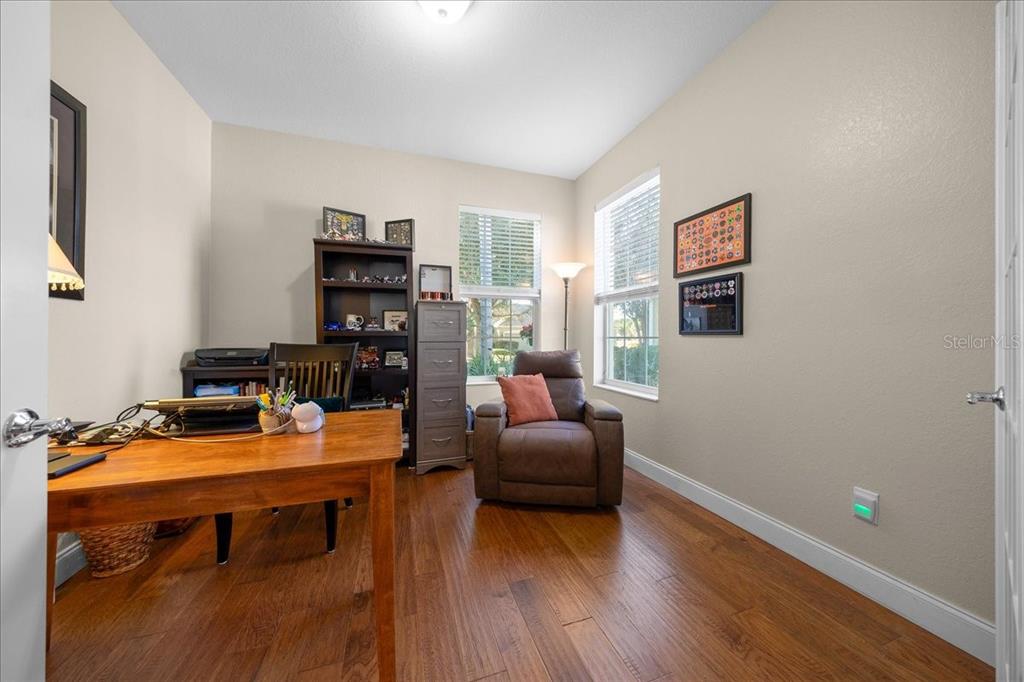 9586 Southwest 70th Loop Ocala, FL 34481 - Photo 17 of 21 a room with furniture and wooden floor