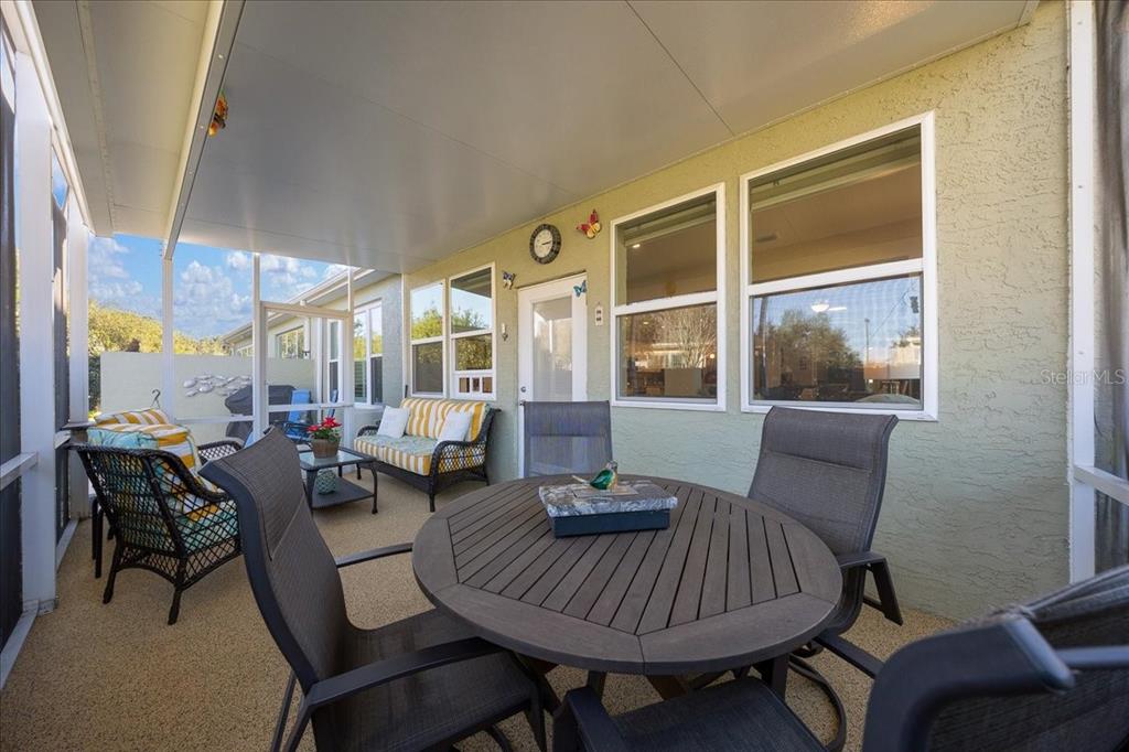 9586 Southwest 70th Loop Ocala, FL 34481 - Photo 4 of 21 a living room with furniture and a large window