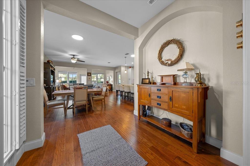 9586 Southwest 70th Loop Ocala, FL 34481 - Photo 5 of 21 a living room with furniture and a mirror