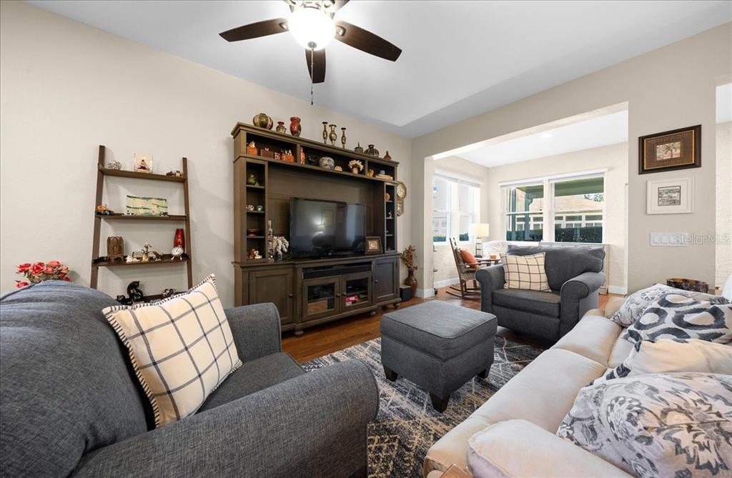 9586 Southwest 70th Loop Ocala, FL 34481 - Photo 9 of 21 a living room with furniture and a flat screen tv