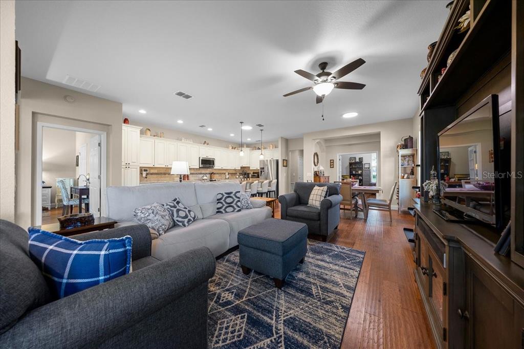 9586 Southwest 70th Loop Ocala, FL 34481 - Photo 10 of 21 a living room with furniture kitchen view and a large window