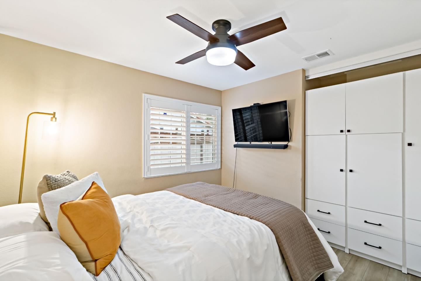 2831 Riedel Road San Jose, CA 95135 - Photo 31 of 53 a bedroom with a bed window and a flat screen tv